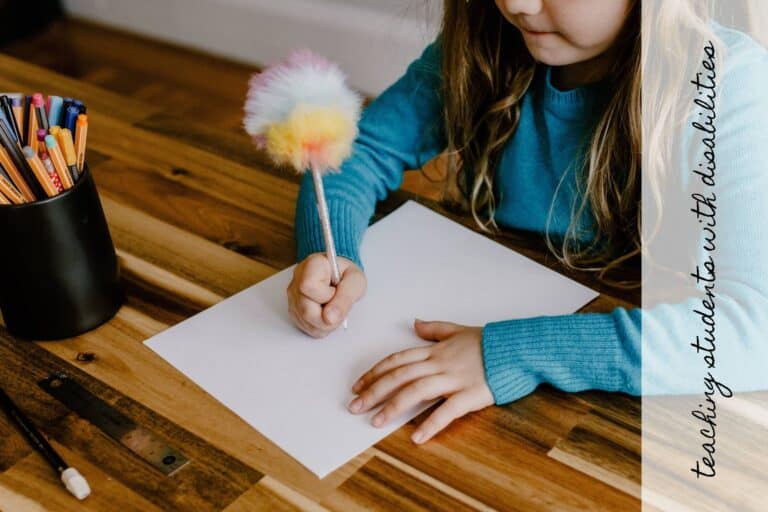 A little girl writes with a sensory pen (Strategies for Teaching a Nonverbal Student with Autism)